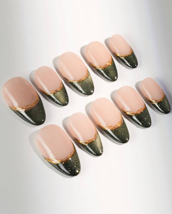 Silk Green press-ons with glossy dark green cat-eye tips and refined metallic gold accents