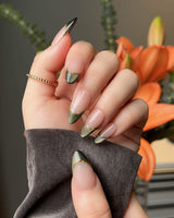 Silk Green nails with emerald magnetic shimmer, nude French base, and gold wire detail