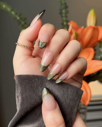Silk Green nails with emerald magnetic shimmer, nude French base, and gold wire detail