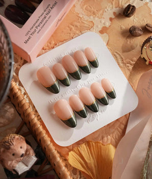 Silk Green nail set with deep green magnetic shimmer, French styling, and gold linework