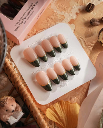 Silk Green nail set with deep green magnetic shimmer, French styling, and gold linework