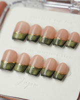 Silk Green in extra short coffin shape with green cat-eye French tips and gold detail