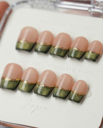Silk Green in extra short coffin shape with green cat-eye French tips and gold detail