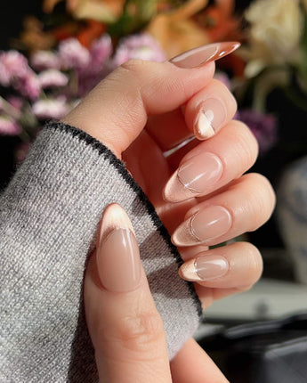 Silk Mousse press-ons with creamy champagne shimmer, silver wire accents, and glossy gel