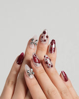 Silver Butterfly nail art close-up showing Silver & Red Gothic, 3D Bows & Blood Drops. details
