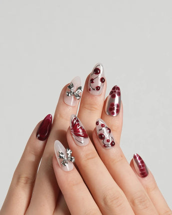 Silver Butterfly nail art close-up showing Silver & Red Gothic, 3D Bows & Blood Drops. details