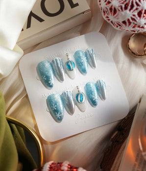 Frozen Dream press-on nail set — ice blue ombre silver chrome snowflake charm design, hand-painted with real gel polish