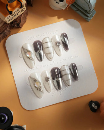 Silver Flame press-on nails in medium almond shape — silver chrome metallic 3D sculpted nails