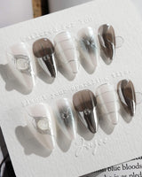 Silver Flame press-on nails in short stiletto shape — silver chrome metallic 3D sculpted nails