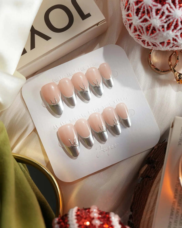 Silver French tip press-on nails with nude base and bow detail