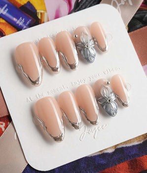 Silver Shore minimalist glam nails with high-gloss silver contours and soft nude base