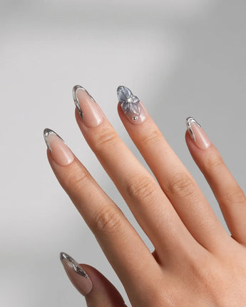 Silver Shore nail art close-up showing Nude & Silver Chrome, 3D Metallic Flower. French nails details