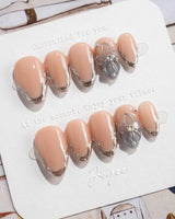 Silver Shore extra short almond nails with glossy nude base and silver French contours