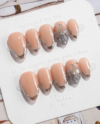 Silver Shore extra short almond nails with glossy nude base and silver French contours