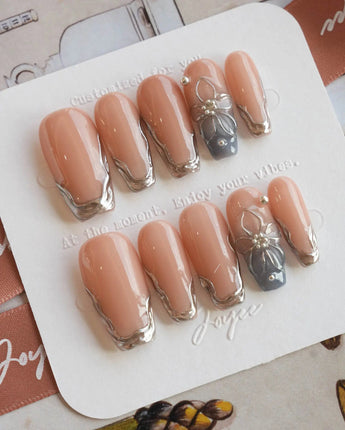 Silver Shore medium coffin nails with chrome silver tips and 3D metallic floral accent