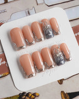 Silver Shore medium square nails with nude silver French design and refined metallic shine