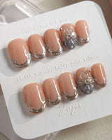 Silver Shore short oval nails with sculpted silver edges and subtle luxury finish