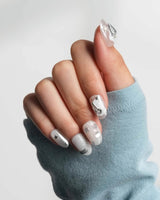 Silver Spoon custom chrome nails with marble gel base and industrial silver accents