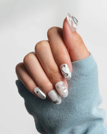 Silver Spoon custom chrome nails with marble gel base and industrial silver accents