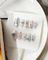 Silver Spoon glossy monochrome nail set with futuristic chrome dessert details