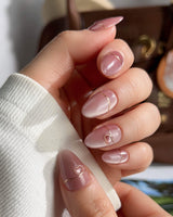 Simple love handmade press-on nails featuring Gentle Blush Cat Eye, Simple Gold Lines & 3D Hearts.