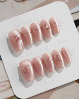 Simple love press-on nails in short coffin shape — Gentle Blush Cat Eye, Simple Gold Lines & 3D Hearts.