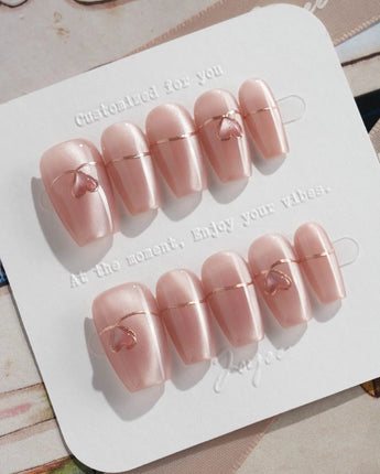 Simple love press-on nails in short coffin shape — Gentle Blush Cat Eye, Simple Gold Lines & 3D Hearts.