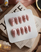 Simple love press-on nails in short stiletto shape — Gentle Blush Cat Eye, Simple Gold Lines & 3D Hearts.