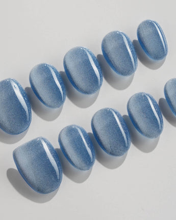Sky Cat-eye press-on nails in extra short oval shape — blue cat eye nails