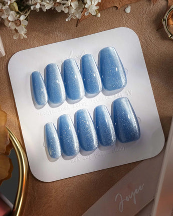 Sky Cat-eye press-on nails in medium coffin shape — blue cat eye nails