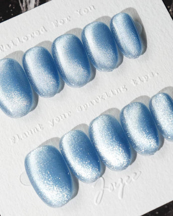 Sky Cat-eye press-on nails in short oval shape — blue cat eye nails
