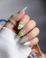 Slushie Apple short almond press-ons with icy cat-eye base and hand-sculpted fruit art
