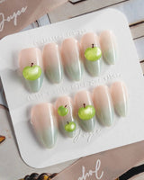 Slushie Apple glossy fruit nails with blue gradient base and crisp apple charms