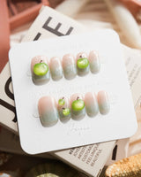 Slushie Apple extra short square nails with icy blue shimmer and 3D green apple art
