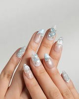 Slushie Blueberry press-on nails with soft nude gel, icy blue texture, and glossy fruit
