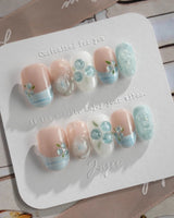 Slushie Blueberry nude cat-eye nails with icy blue plaid and 3D blueberry charms