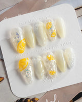 Slushie Lemon close-up of lemon slice nail art on translucent icy gel polish