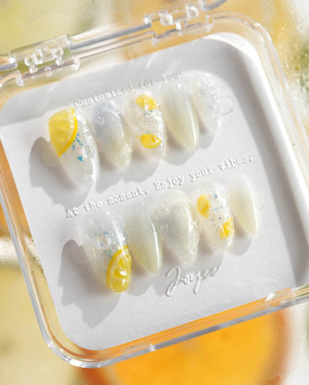 Slushie Lemon nail art close-up showing Translucent Grey & White Glitter, 3D Lemon Soda. details