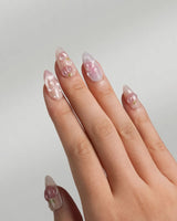 Slushie Peach close-up of peach fruit charms, water droplets, and glossy pink gel