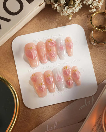 Slushie Peach glossy summer nails with pink shimmer, peach slices, and dew bubbles