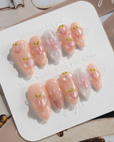 Slushie Peach hand-sculpted peach nails with soft pink ombre and glossy bubbles