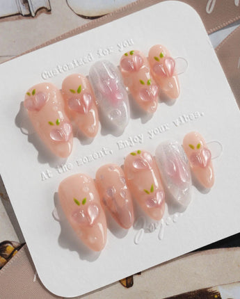 Slushie Peach hand-sculpted peach nails with soft pink ombre and glossy bubbles
