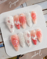 Slushie Strawberry close-up of pink soda nail art with fruit and shell details