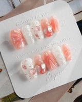 Slushie Strawberry press-on nails dipped in strawberry soda with glossy gel bubbles