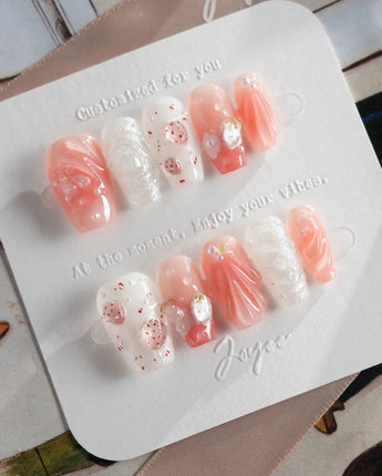 Slushie Strawberry press-on nails dipped in strawberry soda with glossy gel bubbles