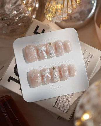 Snowfall press-on nails in extra short square shape — pearl nude cat eye snowflake bow silver glitter soft sheen