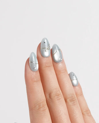Soda Bubble press-on nails in extra short almond shape — Fresh Icy Blue, Simple Gold Wire Bows & Rhinestones.