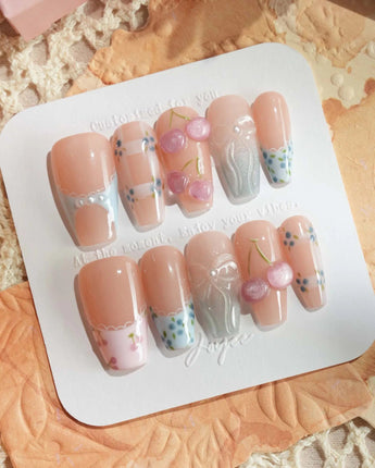 Soft Escape press-on nails in medium coffin shape — Nude & Pastel Blue, 3D Cherries & Lace French