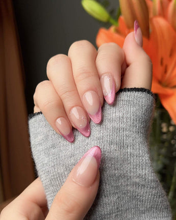 Soft Glow handmade press-on nails featuring Pinkish Purple Cat Eye, French Glittery Stars.