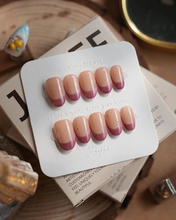 Soft Glow press-on nails in short oval shape — Pinkish Purple Cat Eye, French Glittery Stars.